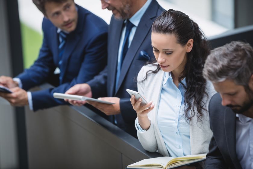 businesspeople using mobile phone and digital tablet