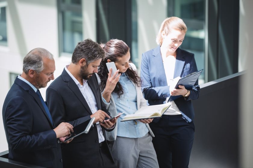 businesspeople using mobile phone and digital tablet 1